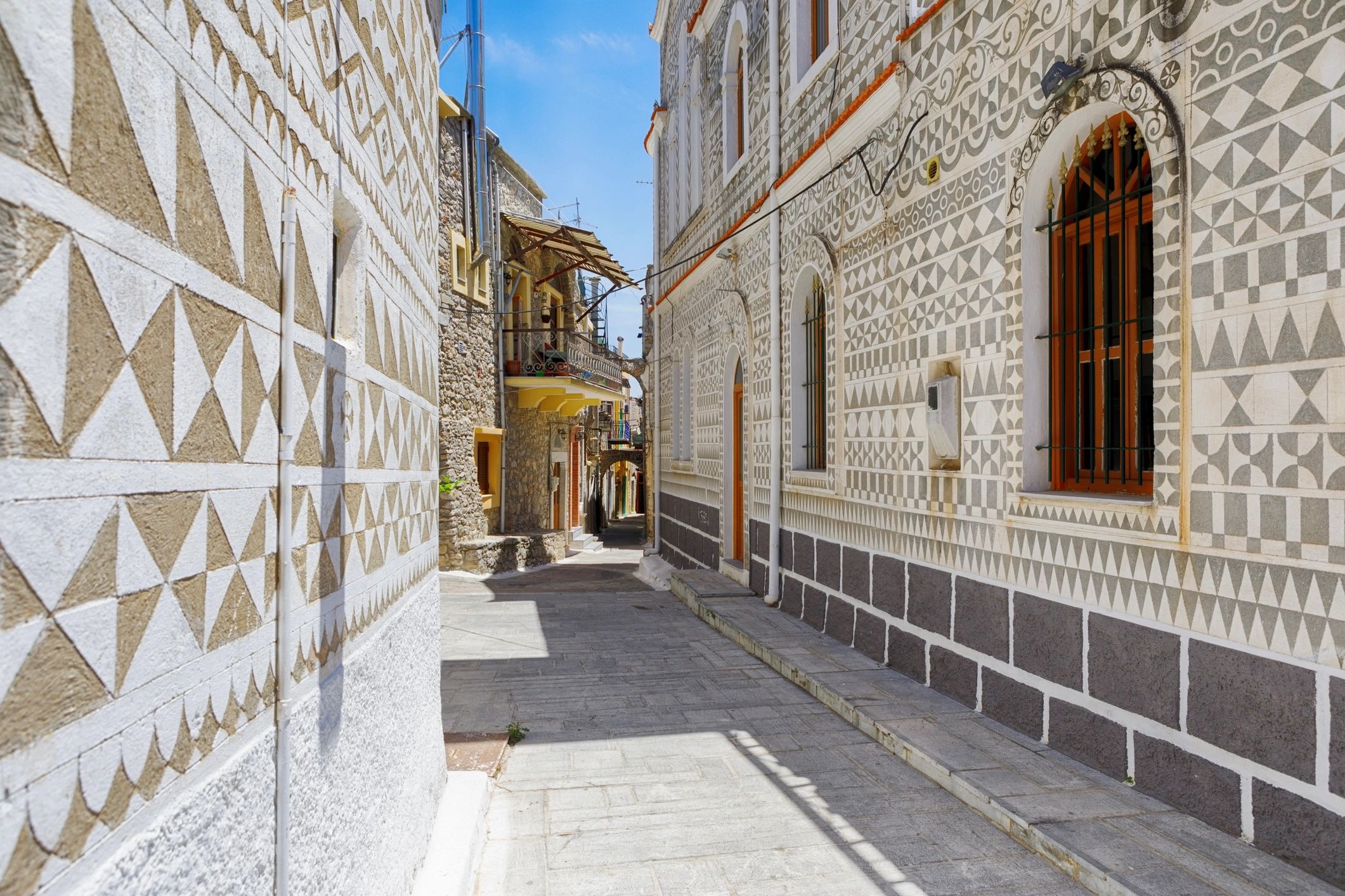 Narrow alley in Pyrgi village on Chios Island, Greece