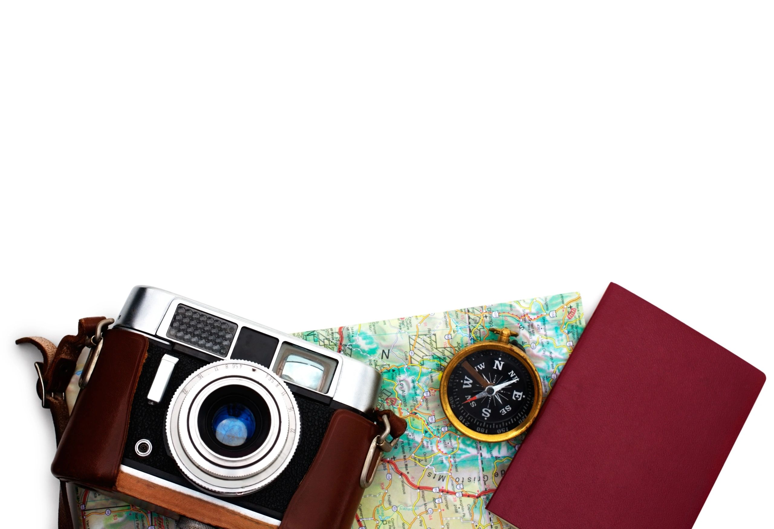Essential travel gear laid out on white background