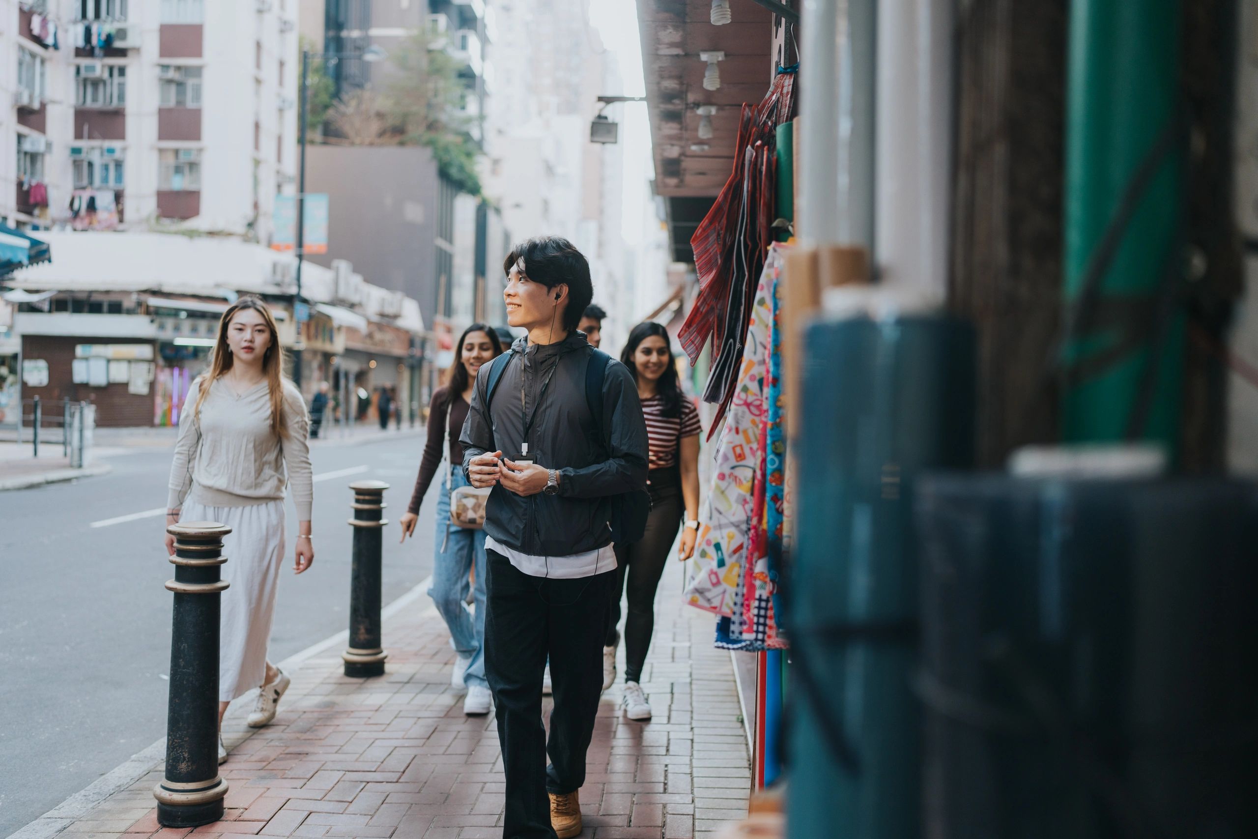Tour guide leading a group of travellers on a city street