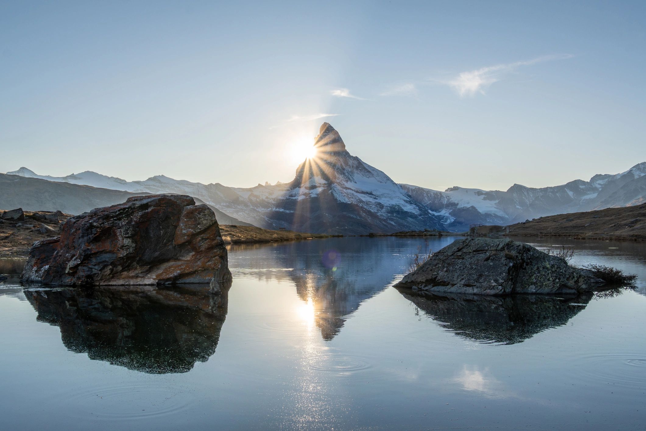 Matterhorn reflected in a Swiss mountain lake at sunset