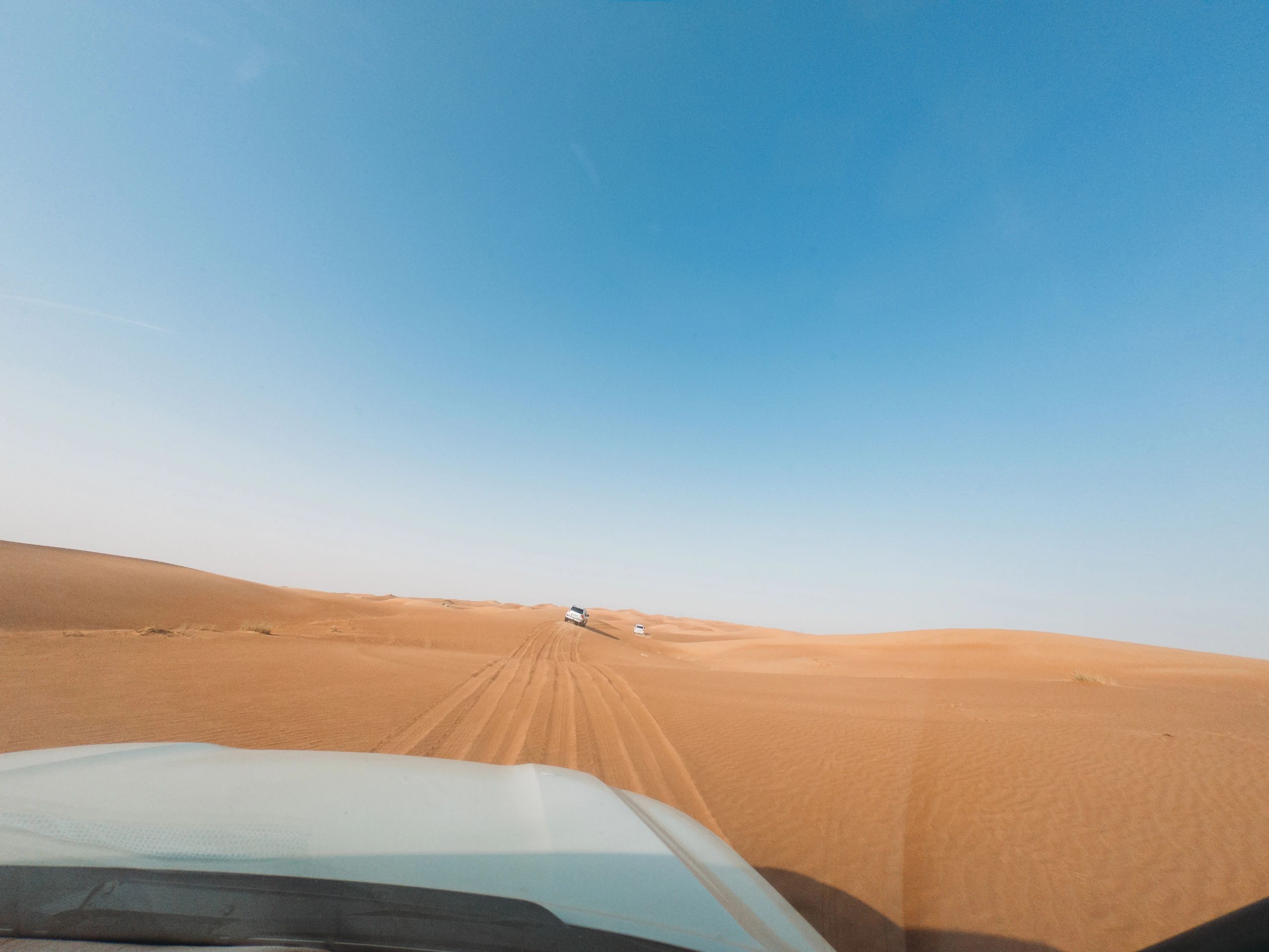Off-road vehicle tracks on sand dunes in the UAE