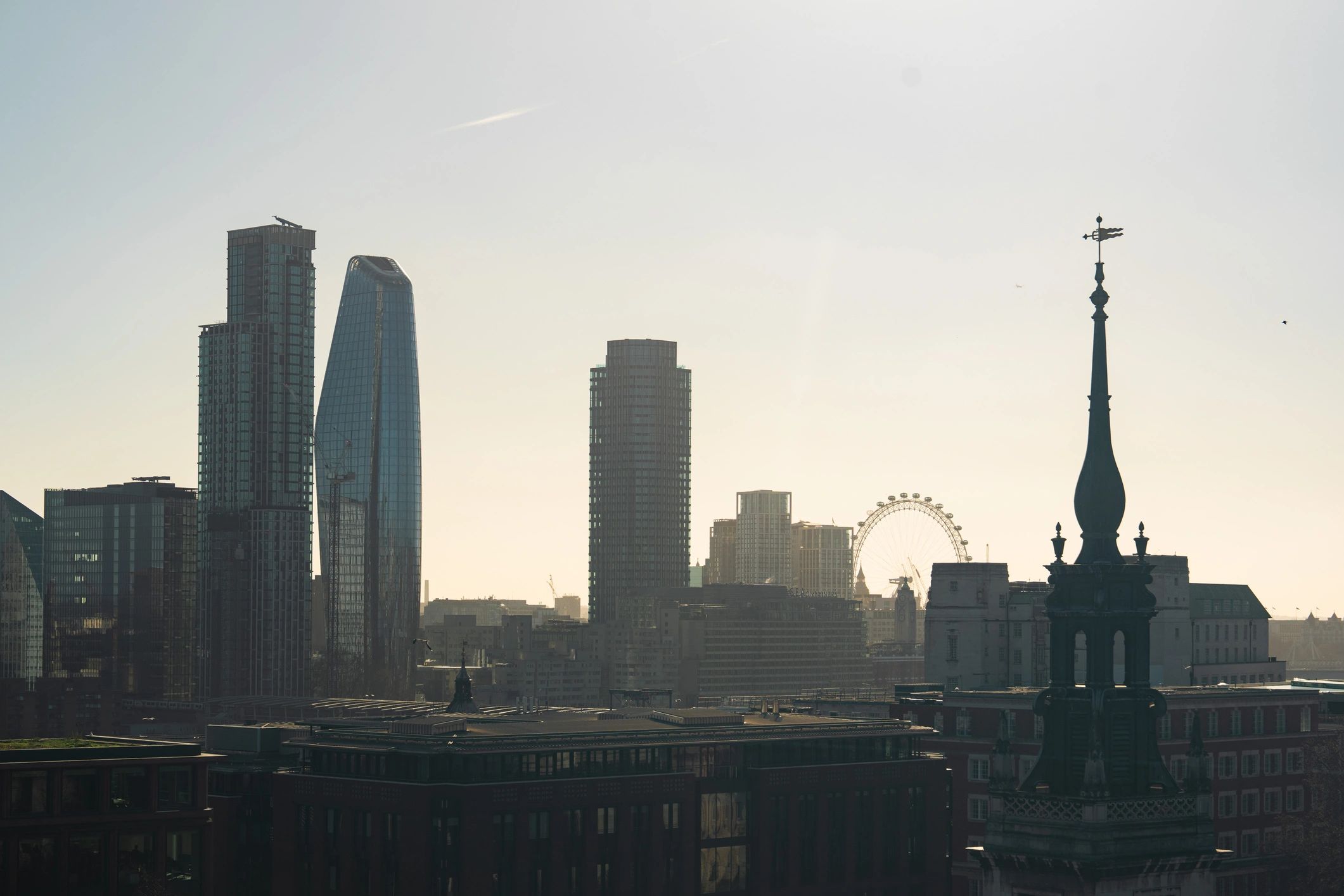 London skyline with church spire and modern buildings