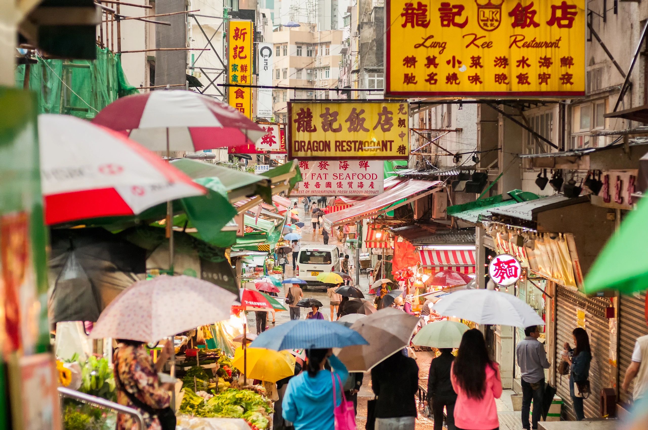 Outdoor market street in Hong Kong with umbrellas